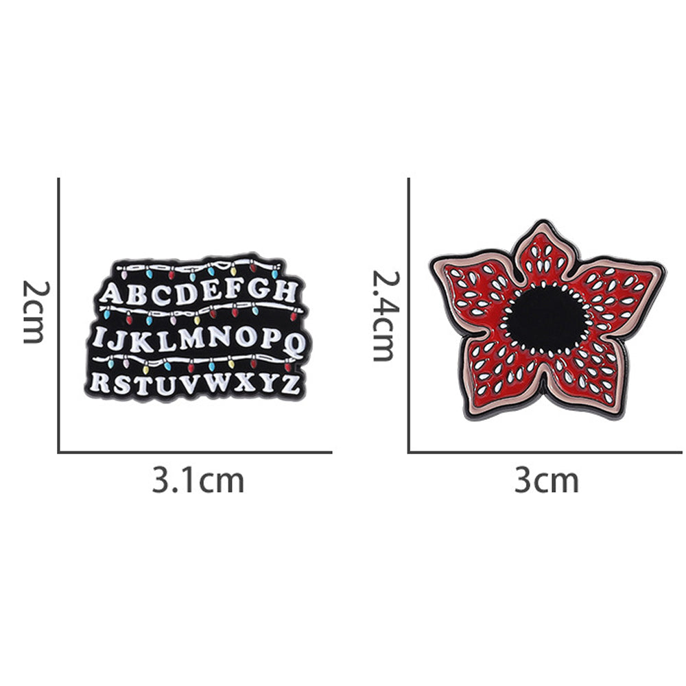 Lot de 2 pin's Stranger Things alphabet et Demogorgon vu de face